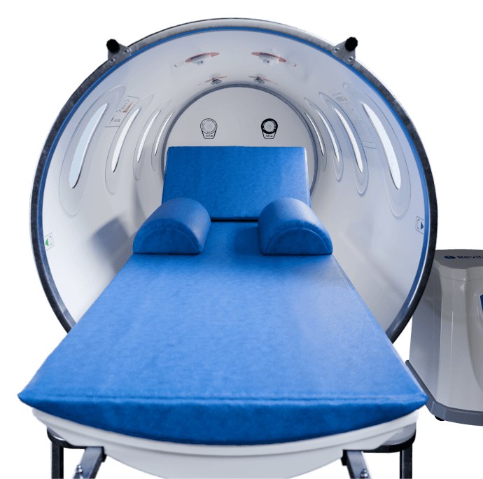Interior of a Revitalair 430+ medical hyperbaric chamber with its mattress and hypoallergenic pillows